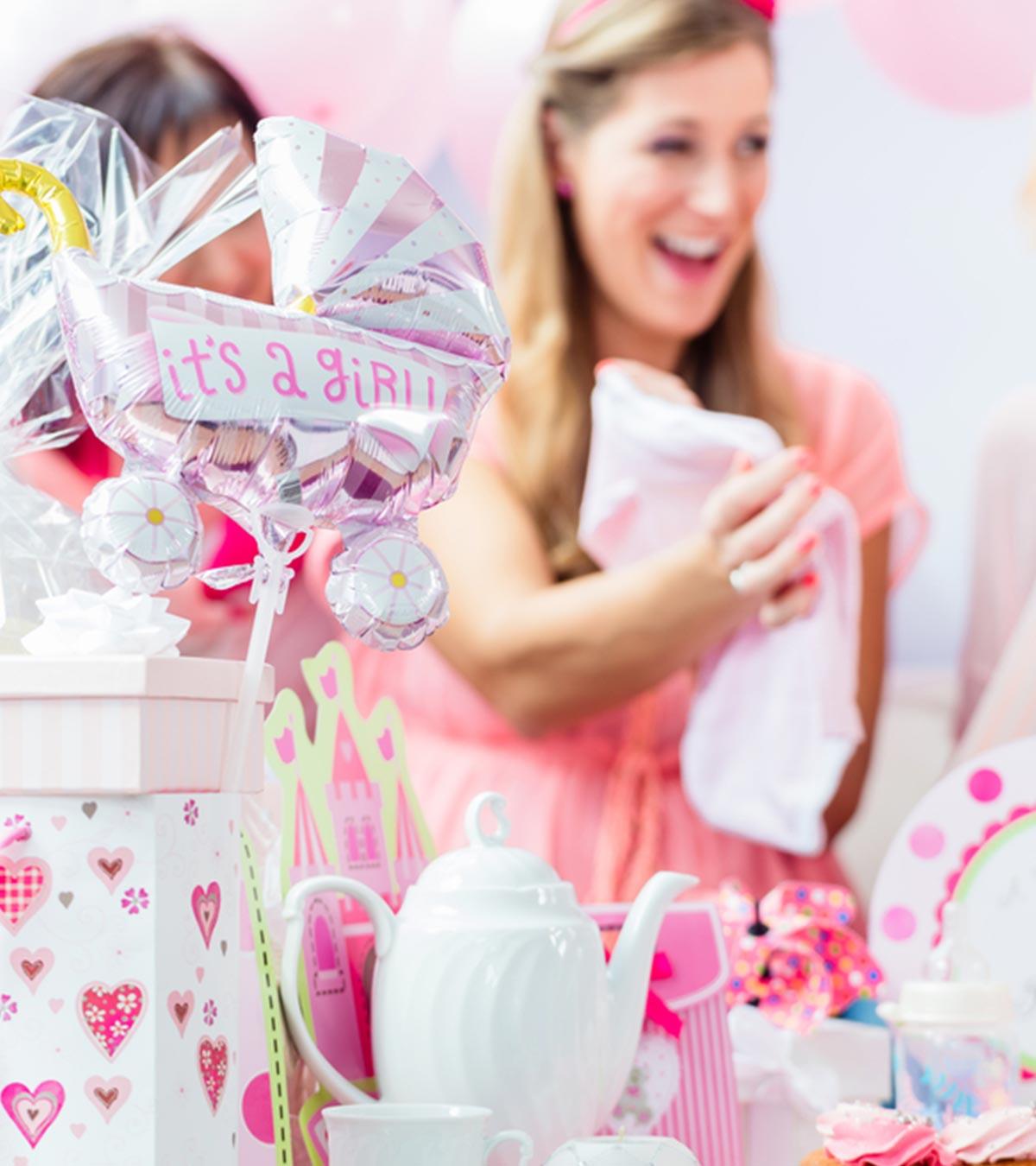A mom decorating a Baby shower party
