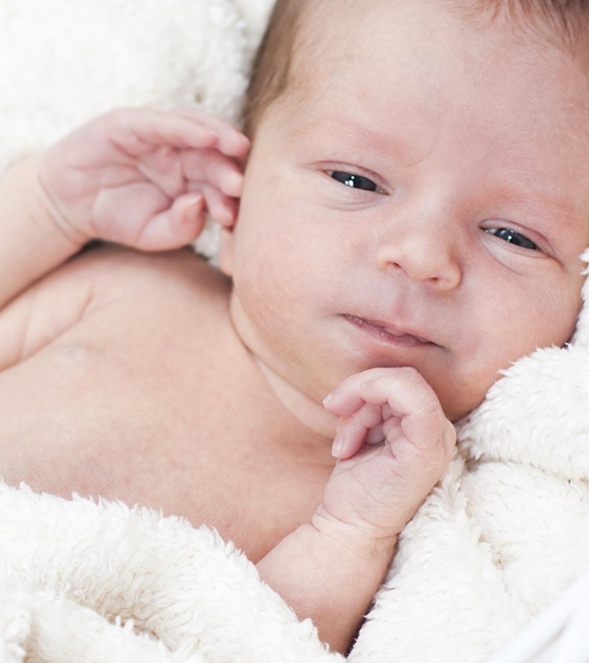 A Baby Sleeping With Eyes Open