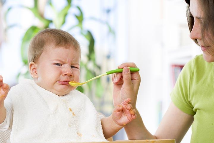 2 month old baby chewing sales on nothing