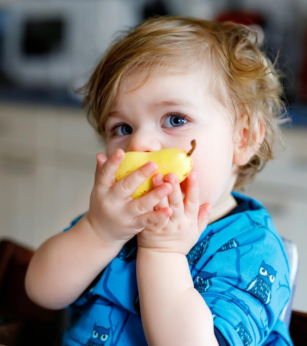 A Baby Eating Pear Fruit