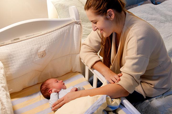 Place the crib near your bed to comfort your baby when needed. 