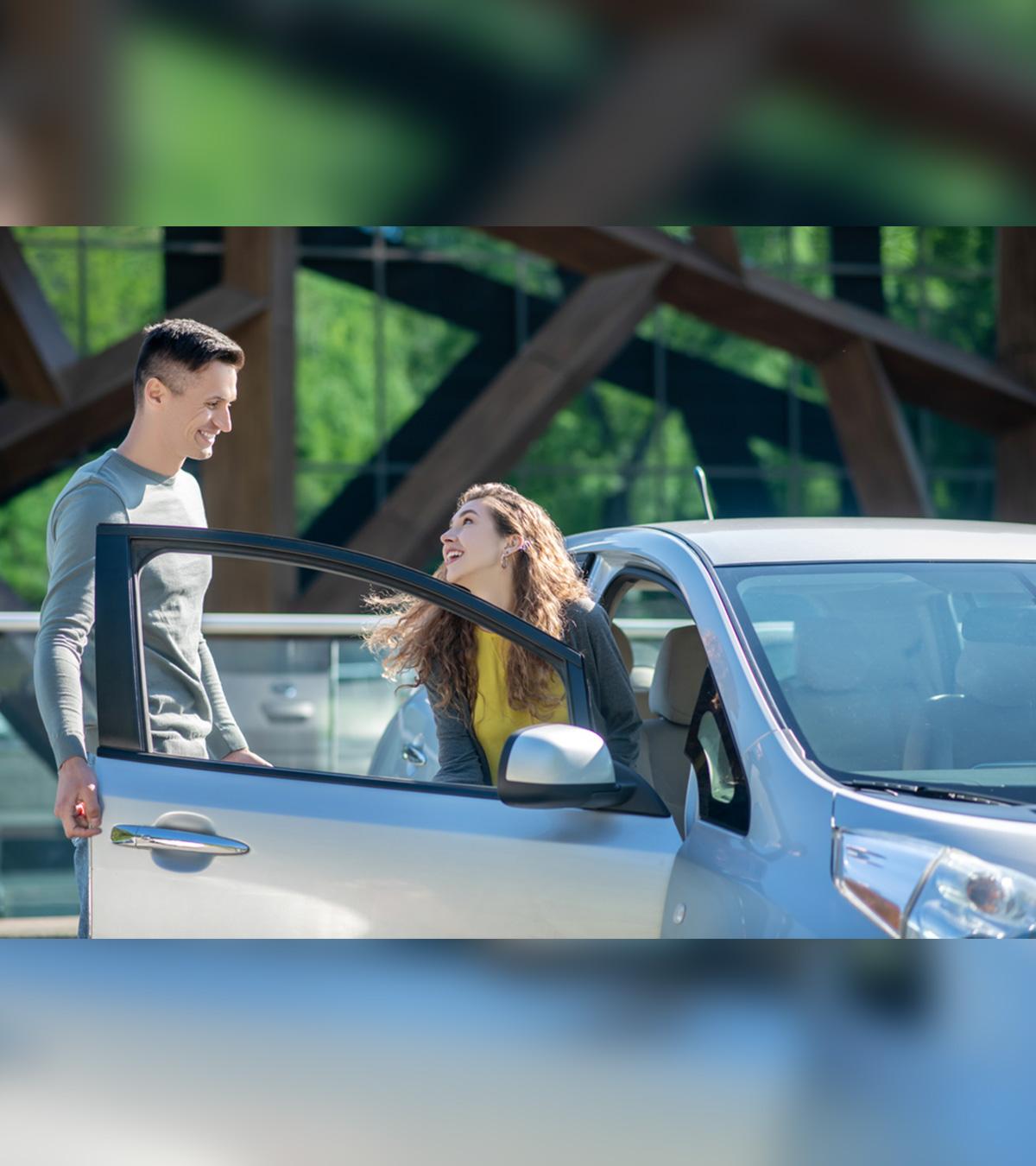 A Man Opening Car Door For His Woman