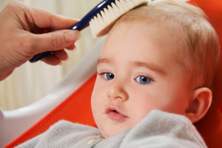 Gently comb the baby's hair