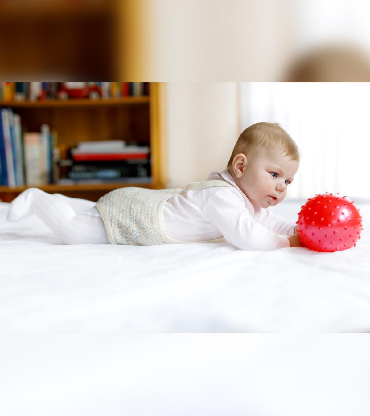 Pediatrician examining a baby for hypertonia