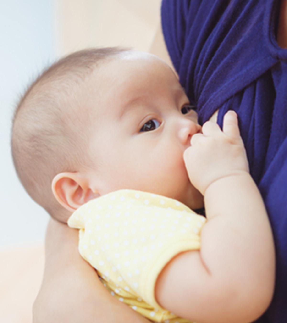 A lady breastfeeding her baby