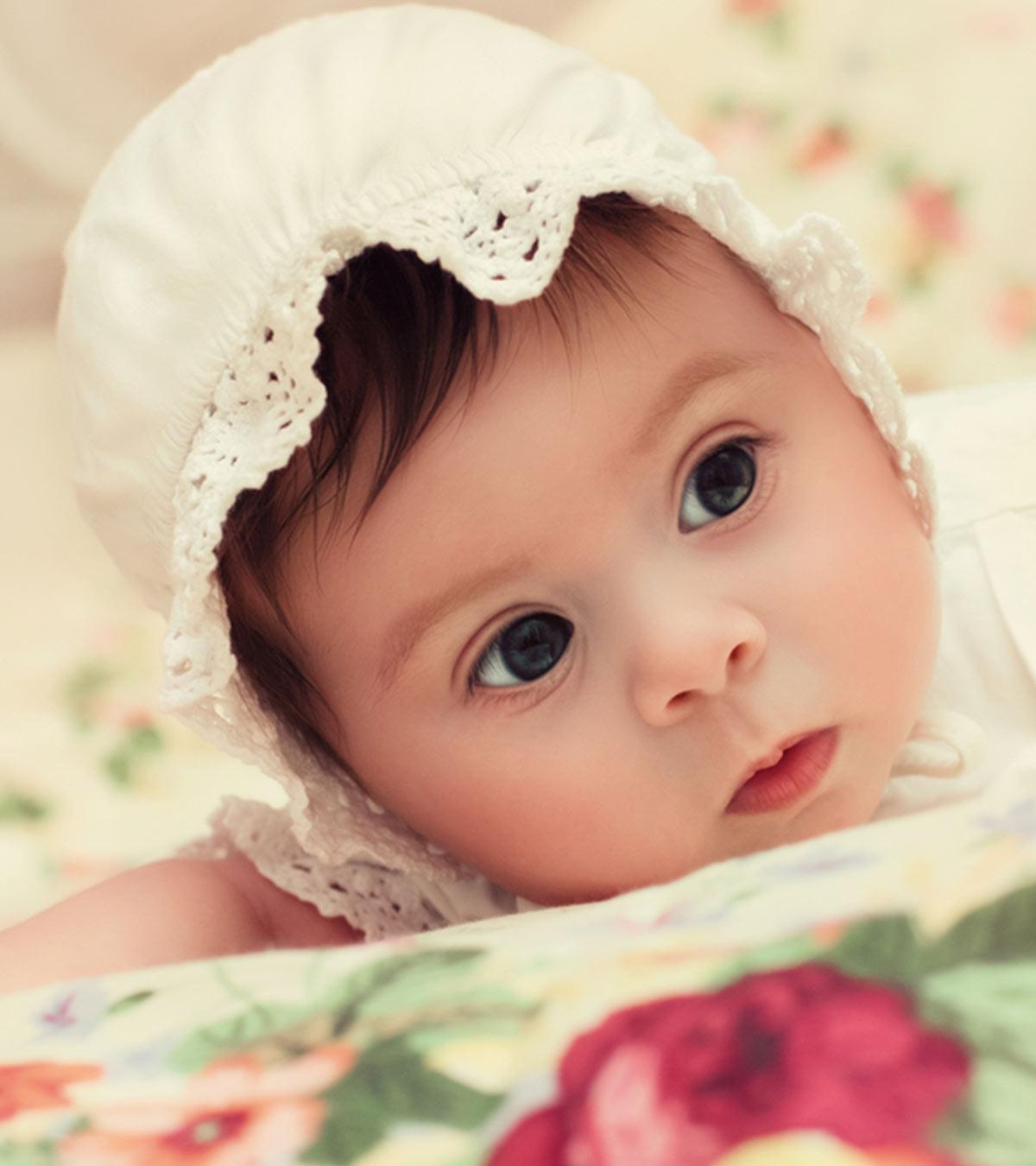 A cute baby in a whi