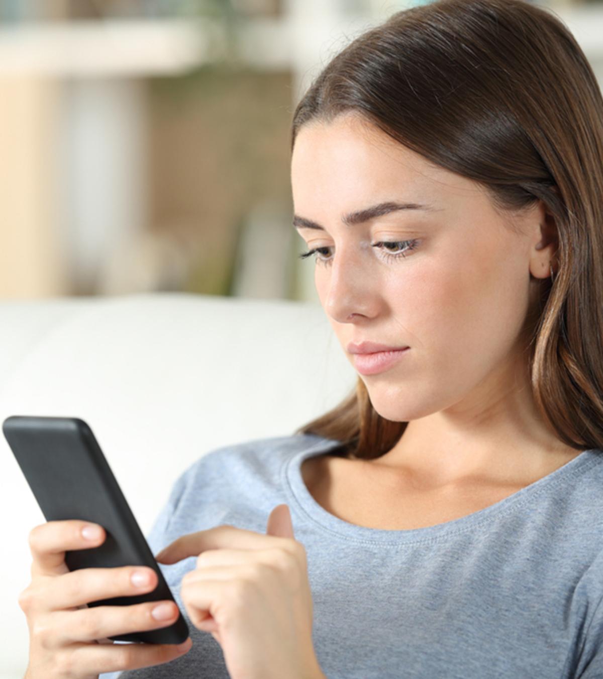 A Woman Thinking To Block Her Ex On Phone