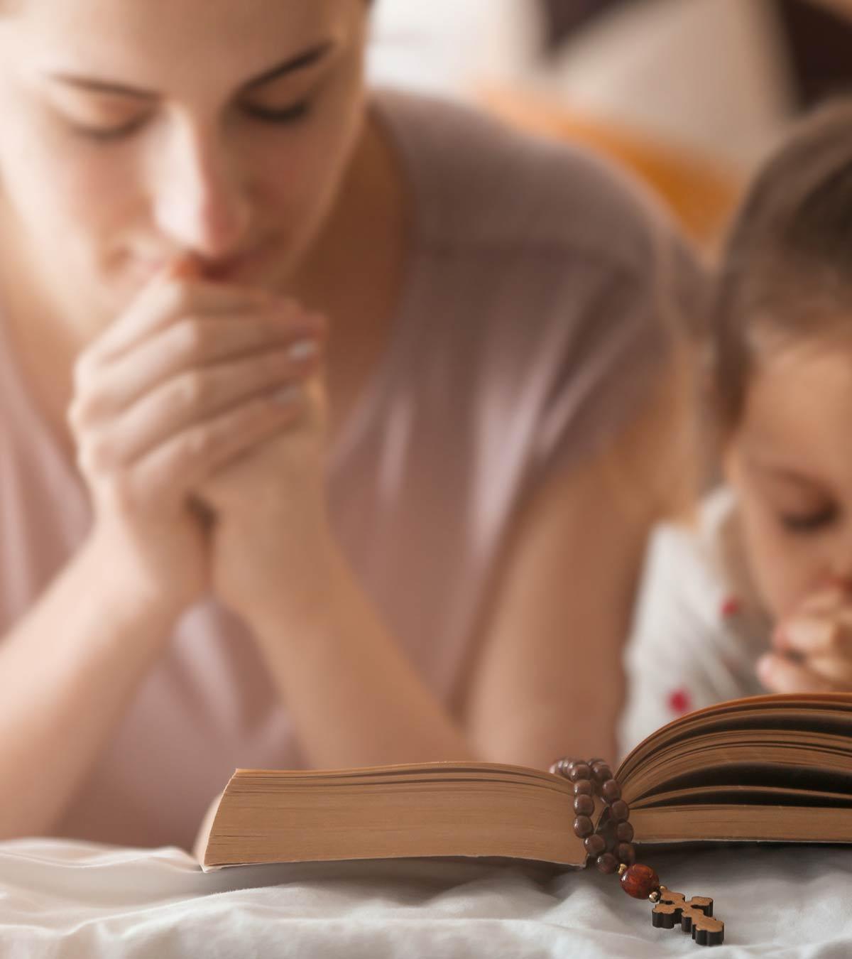A mother and her child reads bible verses