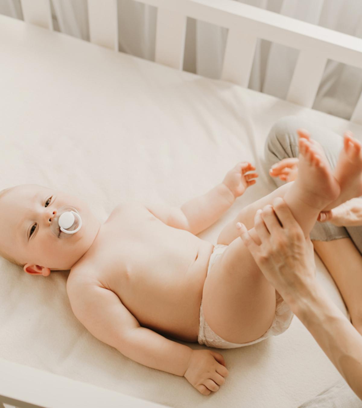 A Mom Checking COlor Of Baby Poop