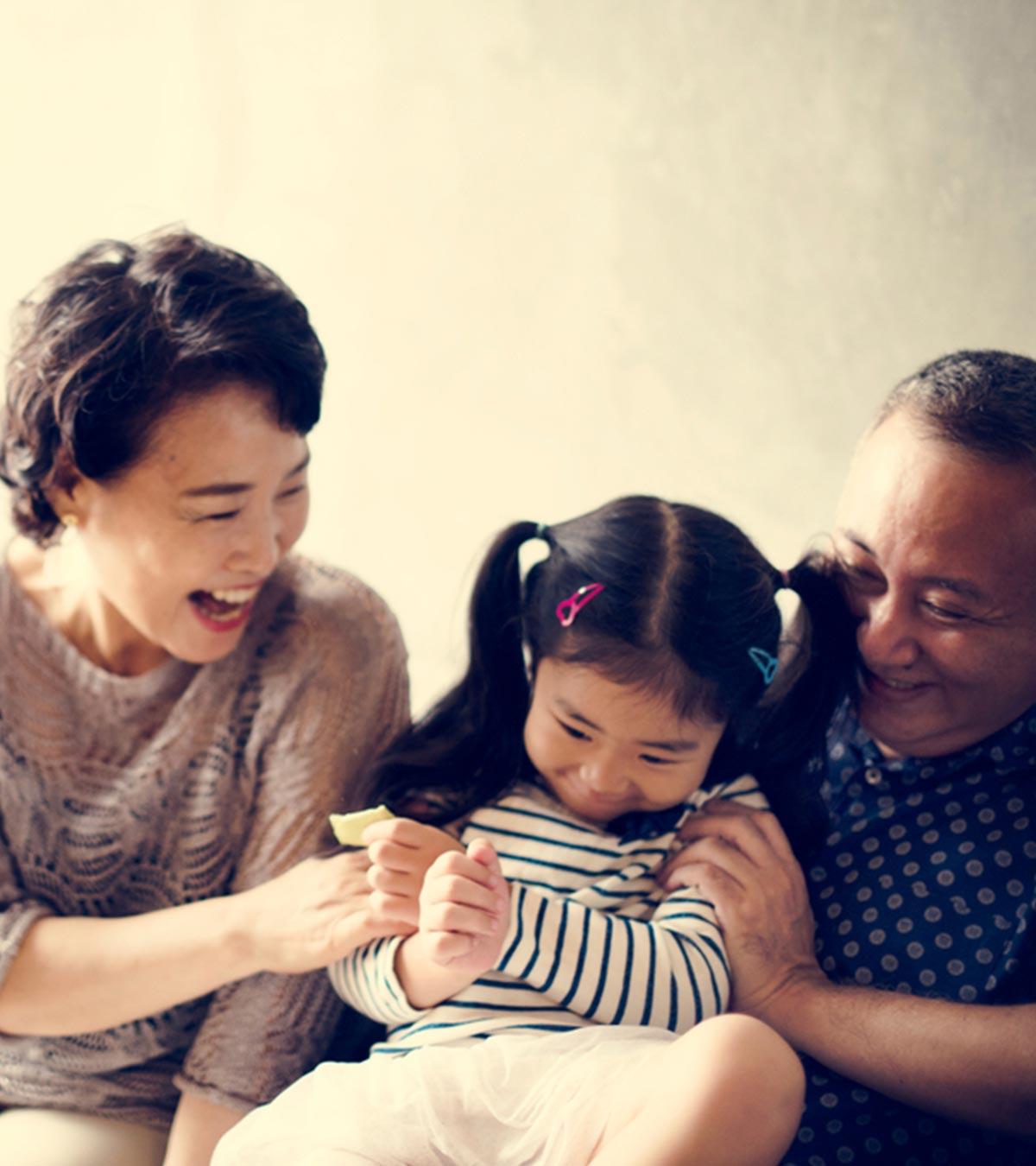 Niece Playing With Aunt And Uncle