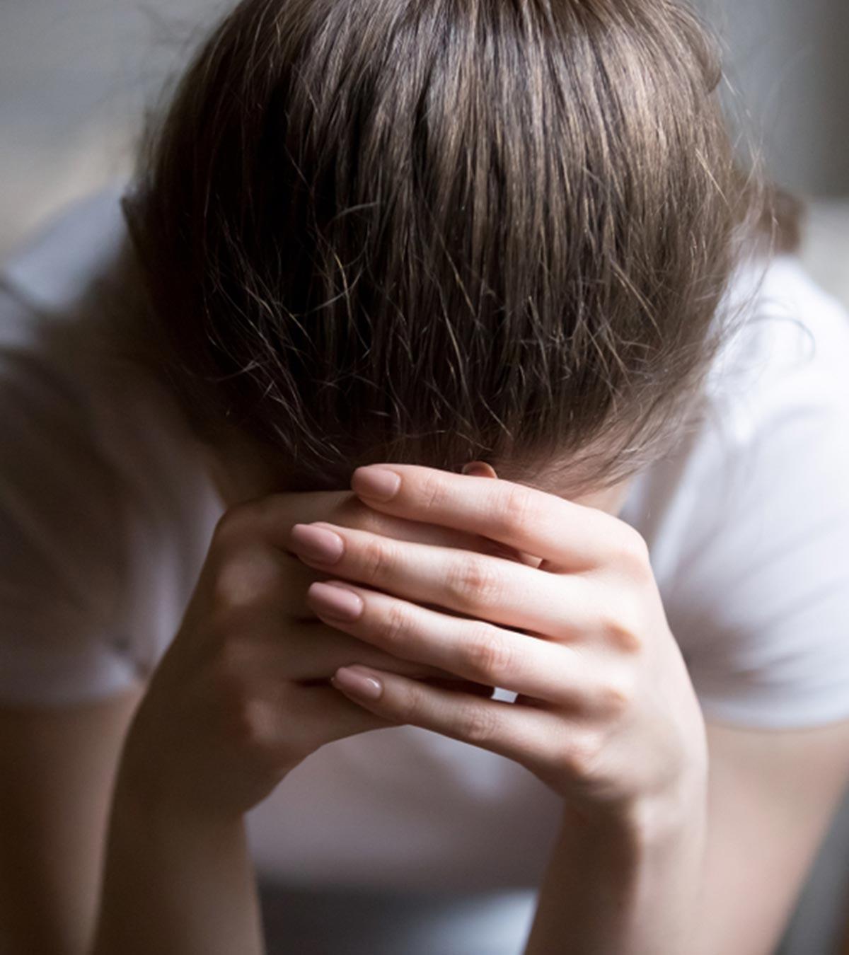 Woman Sitiing Alone And Feeling Sad About Her Life