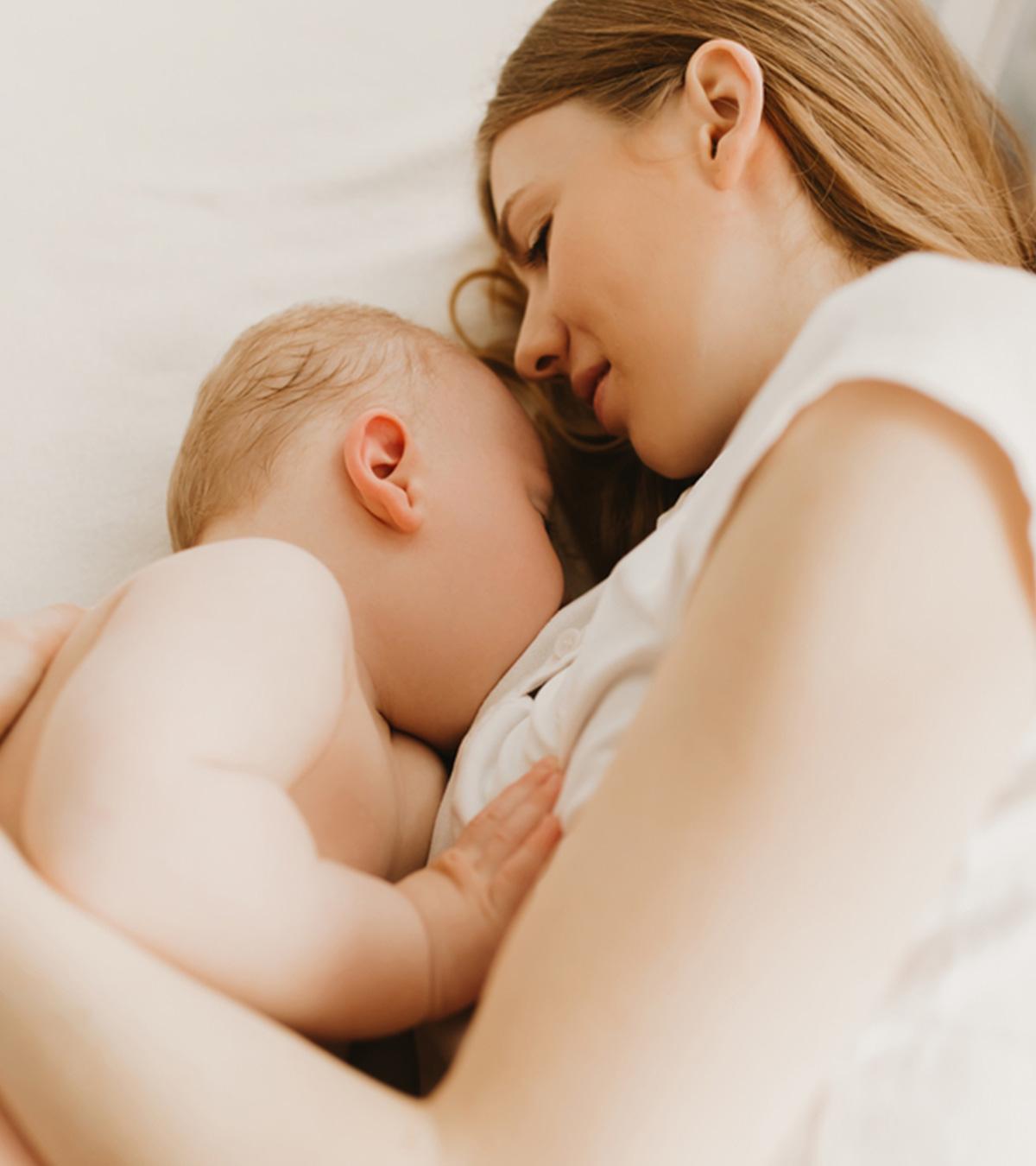 A Woman Breastfeeding With Big Breasts