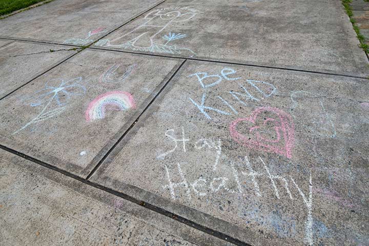 Writing sidewalk messages, kindness activity for kids