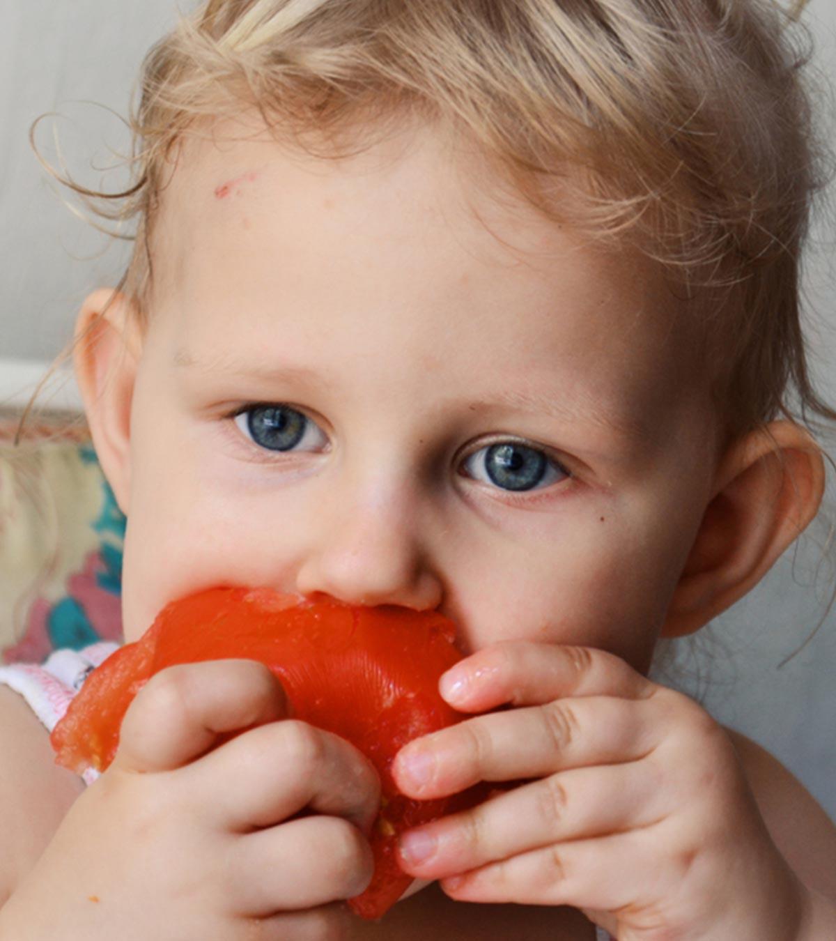 Baby Eating Tomato