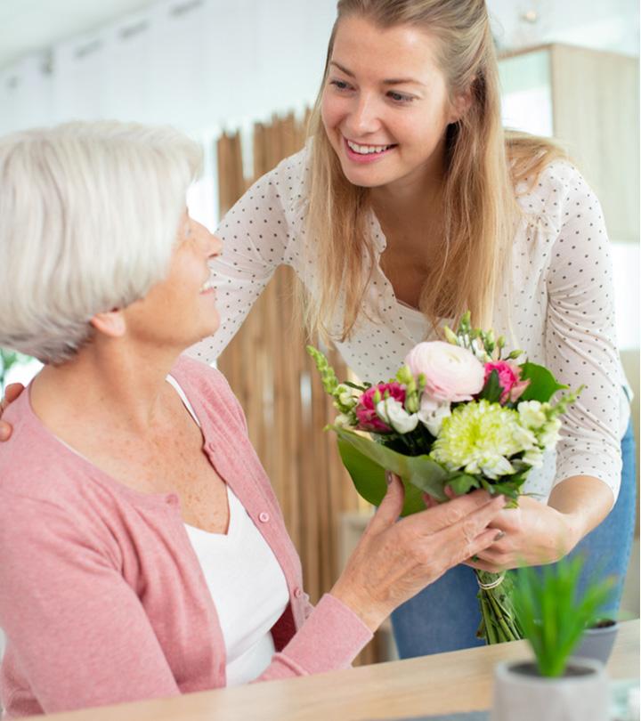 A girl wishing an 80th birthday to an older woman