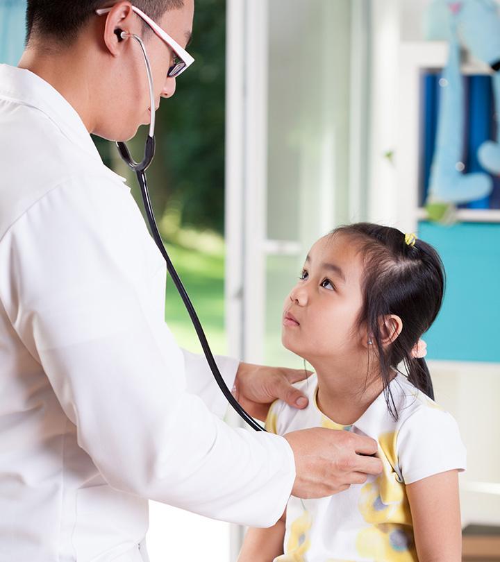 A doctor checking a little girl