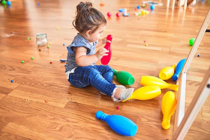 Bowling with coconuts summer activities for toddlers