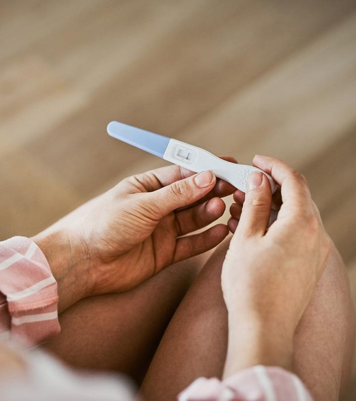 A girl looking at her anovulation result