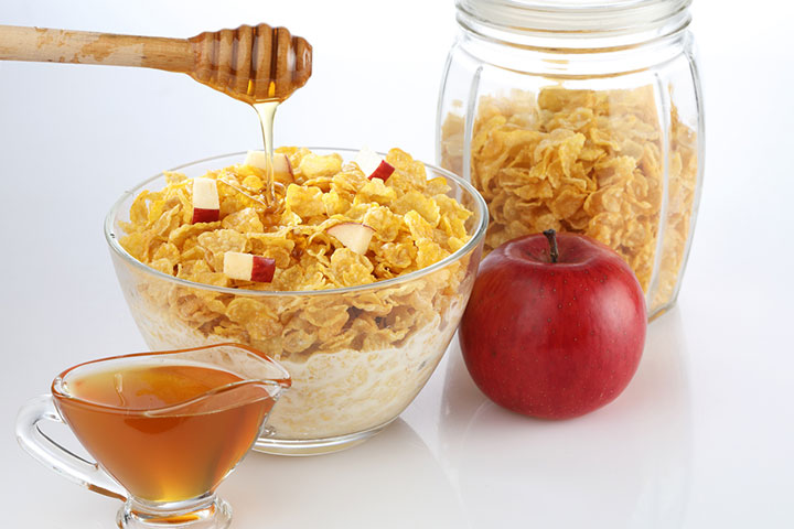Add fruits, honey, and nuts to corn flakes to make it tastier