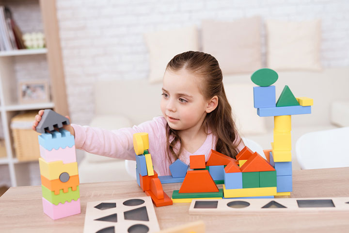 Ask the child to build a three-dimensional dollhouse. 