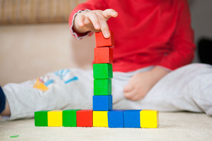 Ask the preschooler to build a tower with blocks. 