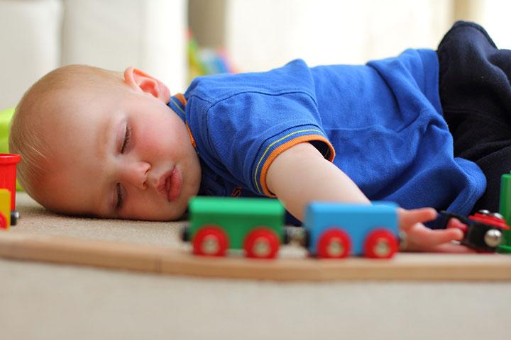 Baby sleeping on sale on floor