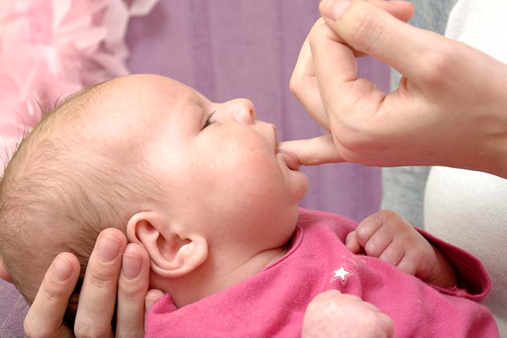 Use your little finger to stimulate the baby's lips