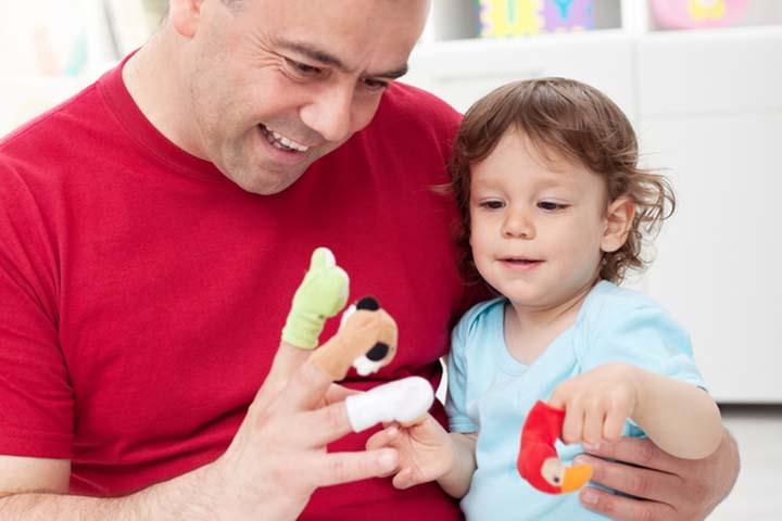Father showing puppets, language activities for toddler