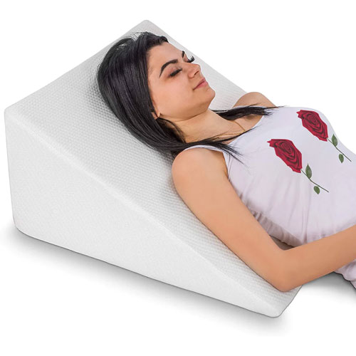 https://www.momjunction.com/wp-content/uploads/2023/02/Abco-Bed-Wedge-Pillow-For-Sleeping.jpg