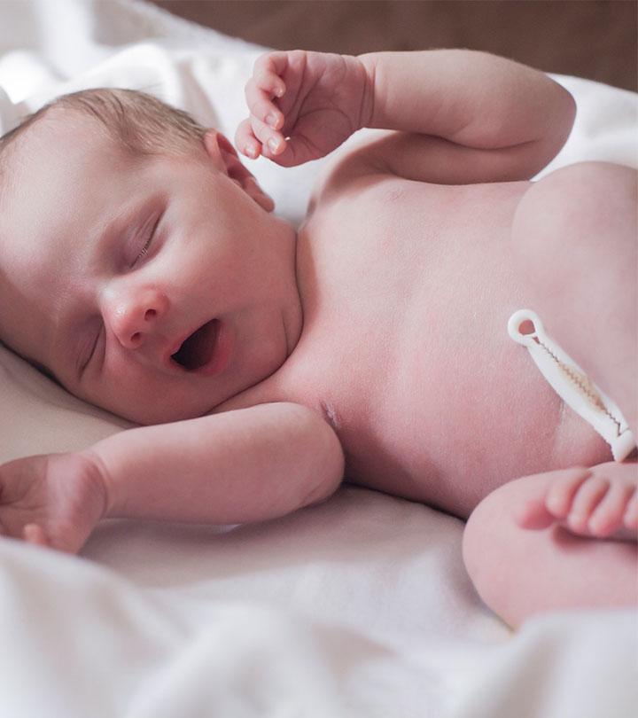 Newborn with a clamped umbilical cord