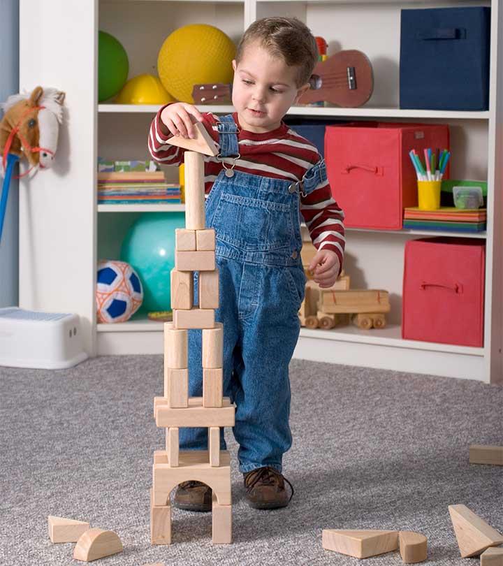 A Kid Playing With Shapes